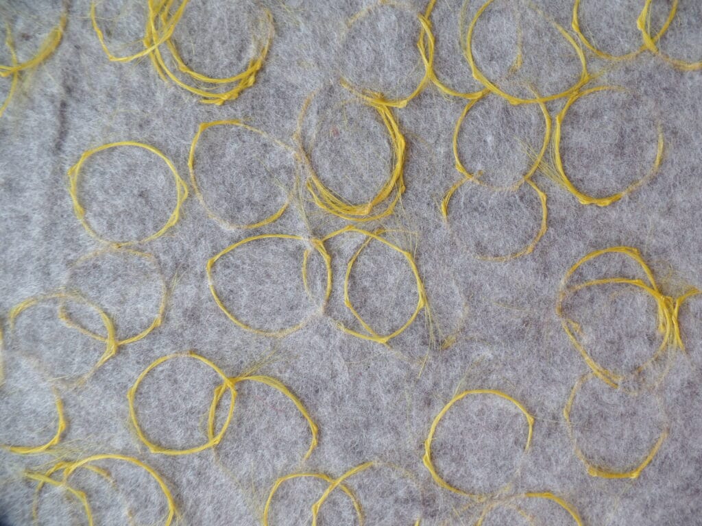 marianne kemp - felted wool with horsehair detail yellow horsehair in grey felt