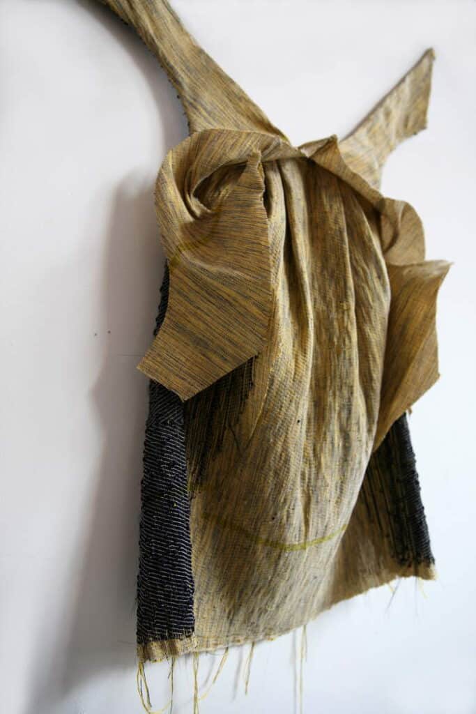 Marianne Kemp - dress backside backside dress on white wall