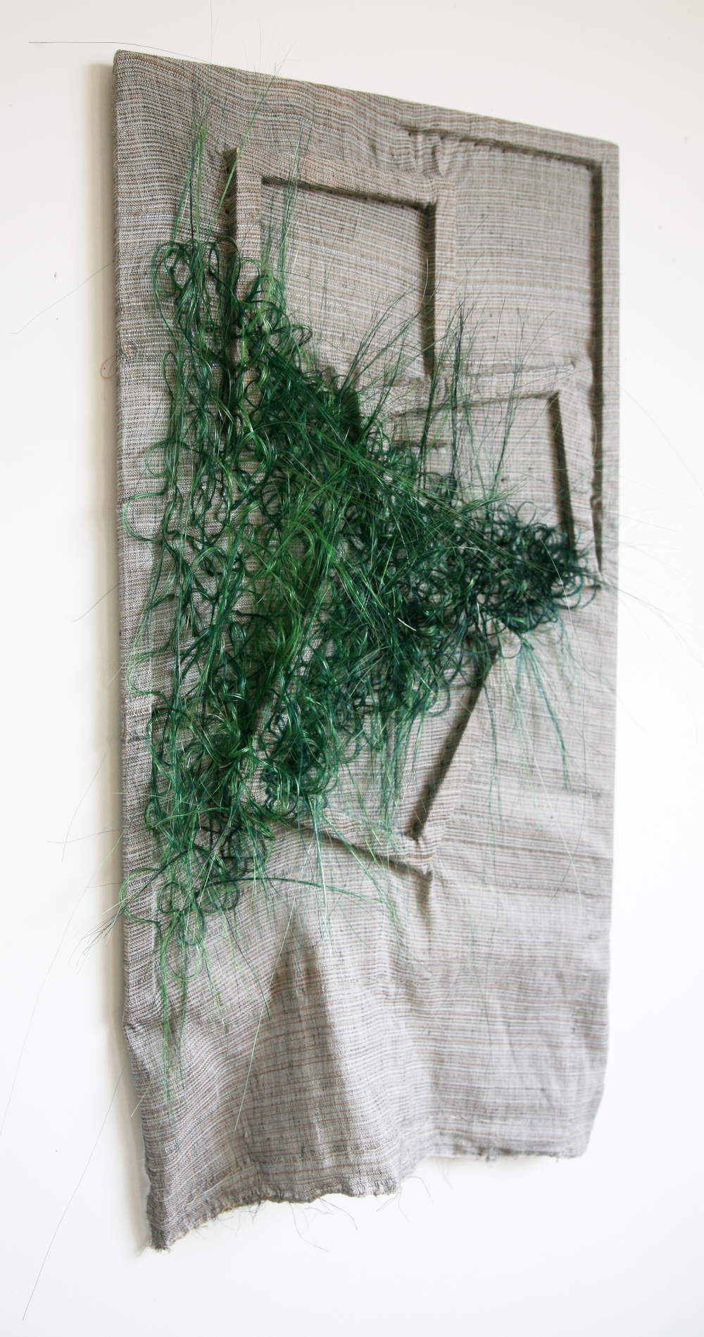 afb Textured green triangle on grey surface